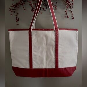 Canvas Tote. Natural with dark red base & straps 15”x22”.New excellent condition
